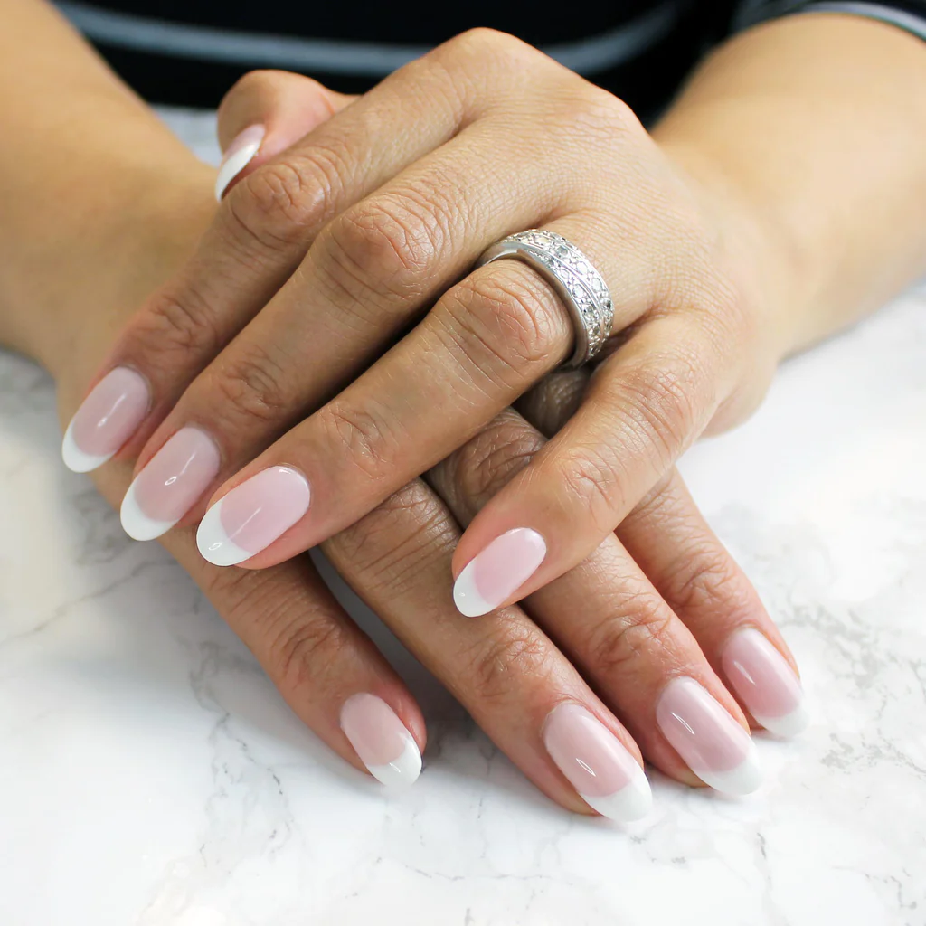 hand with French pedicured nails